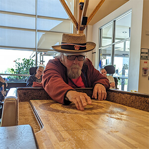 Misericordia Place resident plays shuffeboard